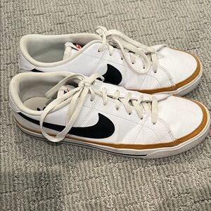 Nike White and Black Sneakers with Gold Accents